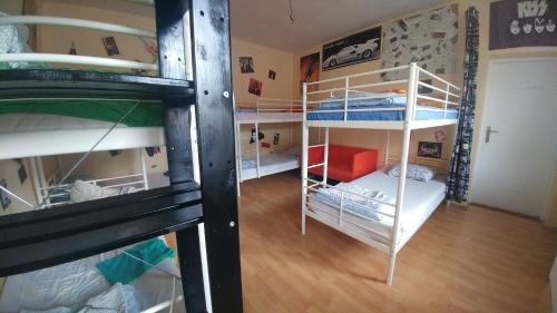 two bunk beds in a small room at Ruta 80 Hostel in Brno