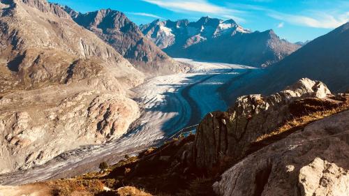 a river in the middle of a mountain range at Bim See in Bettmeralp