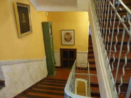 a staircase in a building with yellow walls at Château du Grand Jardin in Valensole
