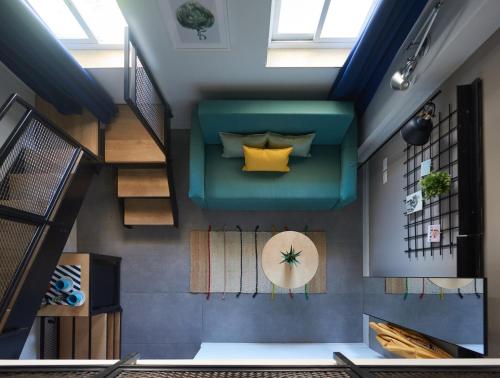 an overhead view of a living room in a house at The Post Hostel Jerusalem in Jerusalem