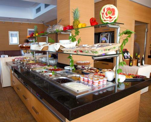 a buffet line with a lot of food on it at Hotel Katja in Bibione