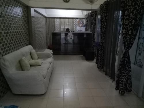 a living room with a couch and a table at Hotel Kameng in Itānagar
