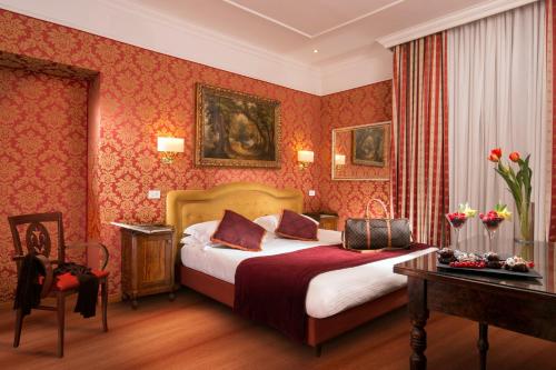 Llit o llits en una habitació de Hotel Morgana