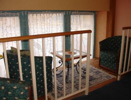 a room with a bed and a table and a chair at Auberge de Marville in Marville