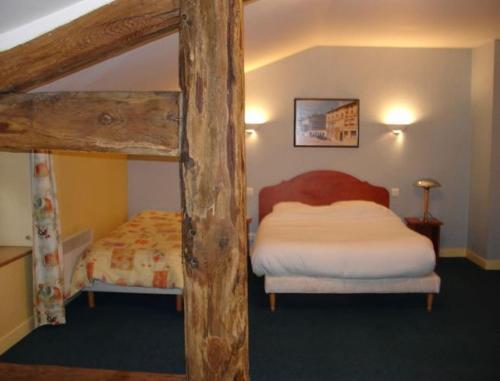 a bedroom with a bed and a bunk bed with at Auberge de Marville in Marville
