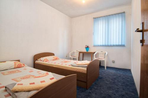 Postel nebo postele na pokoji v ubytování Apartmani Jogunica