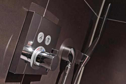 a close up of a bathroom door with a knob at Zaan Hotel Amsterdam - Zaandam in Zaandam