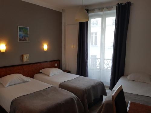 En eller flere senger på et rom på Le Saint Hubert - Adriatic Hotel
