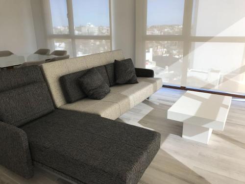 a living room with a couch and a table at Aizarker in La Plata