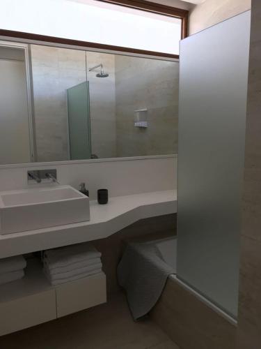 a bathroom with a sink and a mirror at Aizarker in La Plata