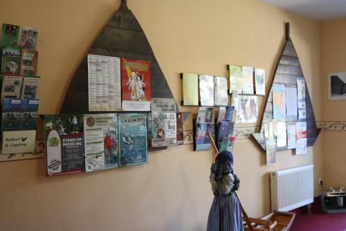 a wall with a bunch of posters on it at Radduscher Hafen in Vetschau