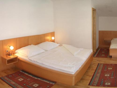 Postel nebo postele na pokoji v ubytování Appartements Hirner