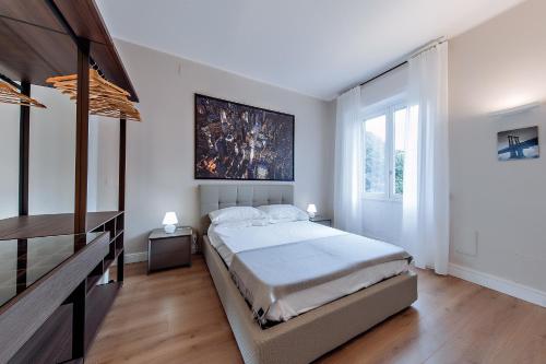 Postel nebo postele na pokoji v ubytování Milano Manzoni CLC Apartments