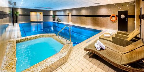 a pool in a hotel room with a hot tub at Best Western Plus The Connaught Hotel and Spa in Bournemouth