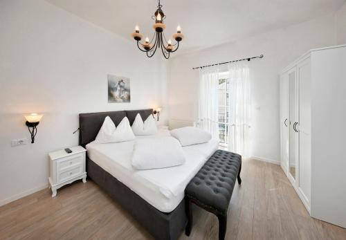 Posteľ alebo postele v izbe v ubytovaní Garni Villa Tyrol - Adults Only