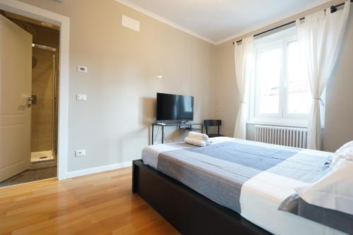 Ένα ή περισσότερα κρεβάτια σε δωμάτιο στο Garibaldino Rooms