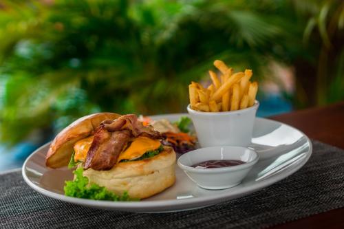 a plate of food with a sandwich and french fries at Hello Cambodia Boutique in Siem Reap