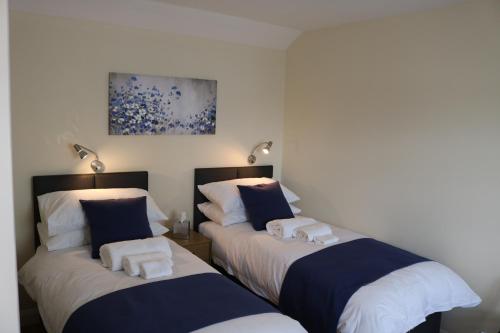 A bed or beds in a room at Gonalston Boutique B&B