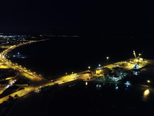 a view of a parking lot at night at b&b Tosches in Barletta
