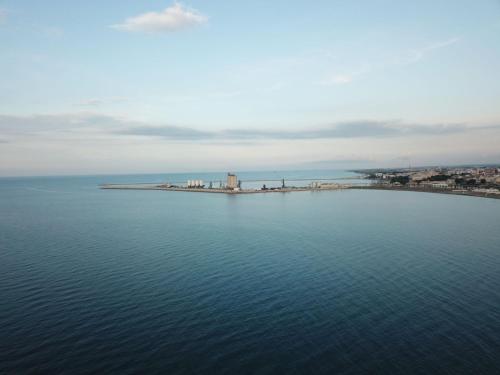 an island in the middle of a body of water at b&b Tosches in Barletta