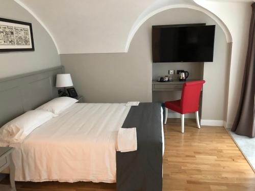 Кровать или кровати в номере Hotel De Ville
