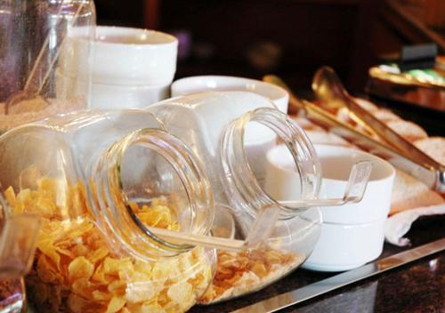 a glass jar filled with food on a table at Canto da Floresta Ecoresort in Amparo
