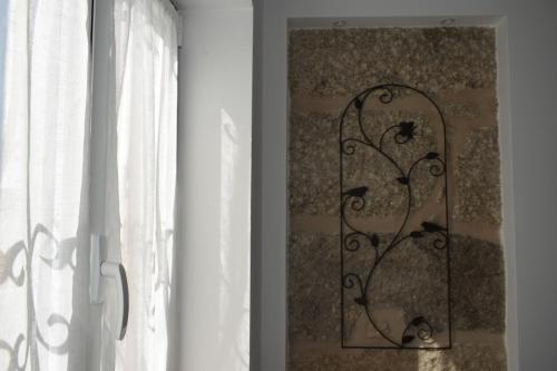 a window with a picture of a bird on the wall at Oporto Living Apartments in Porto