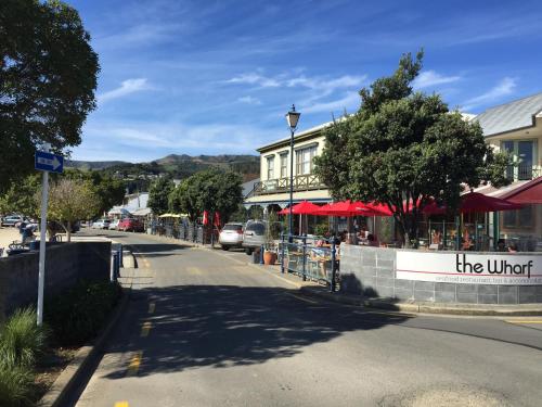 a street in a town with a sign that reads the united at The Studio Akaroa in Akaroa