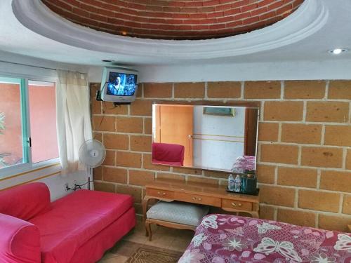 TV a/nebo společenská místnost v ubytování Hotel Posada Mexicana