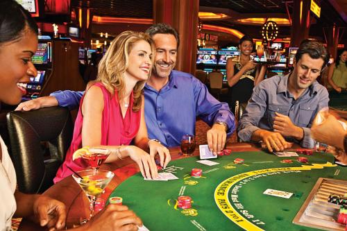 a group of people playing roulette in a casino at L'Auberge Baton Rouge in Baton Rouge