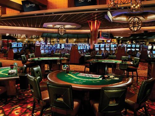 a casino on a cruise ship with poker tables at L'Auberge Baton Rouge in Baton Rouge