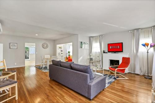 a living room with a couch and a fireplace at Long Beach House in Long Beach