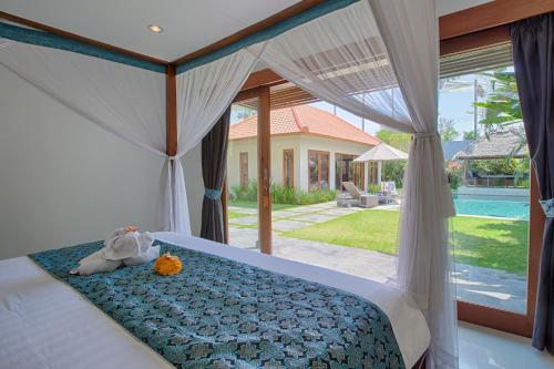 Postel nebo postele na pokoji v ubytování Amore Villas