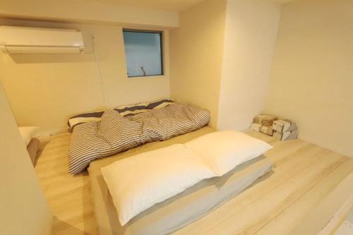 Кровать или кровати в номере Shibuya Anon #A102