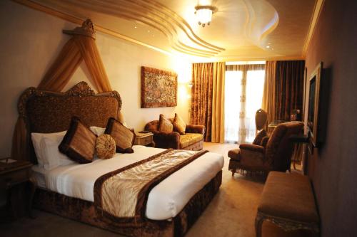 a hotel room with a large bed in a room at Q Hotel in Beirut
