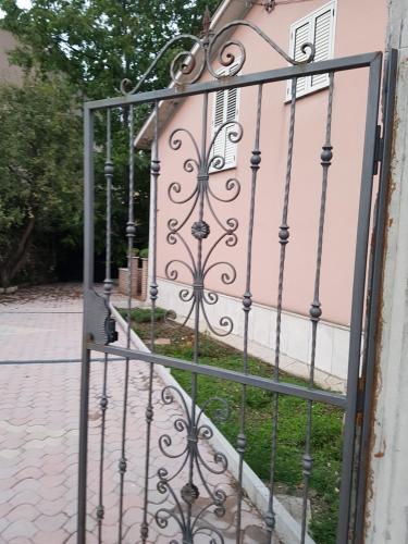 a gate in front of a pink building at Casa Rosa in Montella