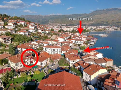 a view of a town with a red arrow pointing to a house at Jovanovic Guest House in Ohrid