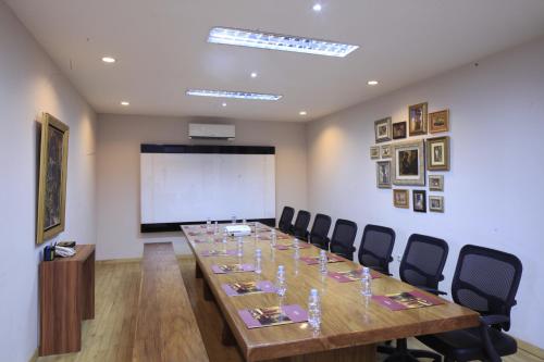 a conference room with a long table and chairs at Bale Ocasa by Behomy in Tangerang