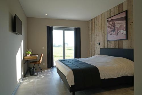 Postel nebo postele na pokoji v ubytování B&B Ten Doele
