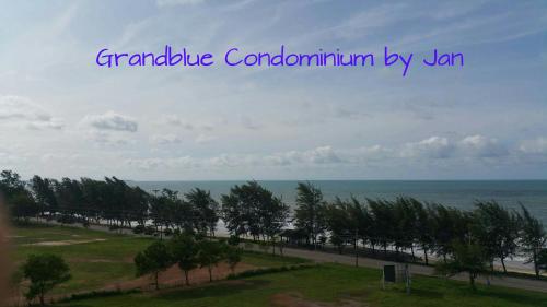a view of a beach with trees and the ocean at Grandblue 311 in Mae Pim