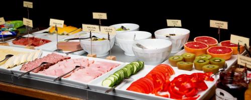 a buffet of different types of food on a table at Sure Hotel by Best Western Algen in Östersund