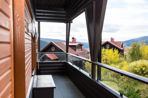 a balcony with a view of the mountains at Åre Travel - Tottbacken in Åre