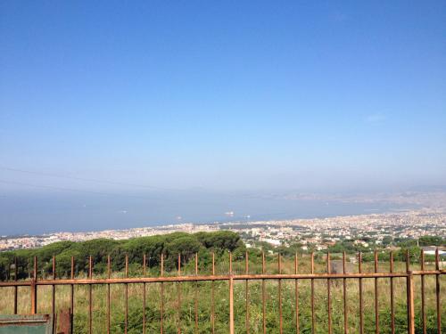 a fence with a view of a city at La Casuccia in Ercolano