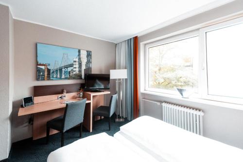 Ένα ή περισσότερα κρεβάτια σε δωμάτιο στο Hotel am Rothenbaum