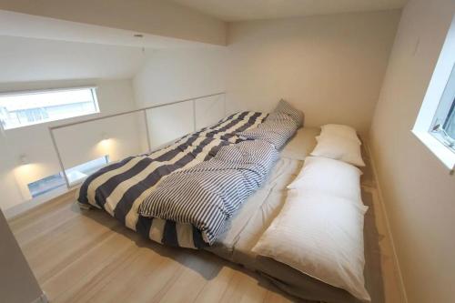 Кровать или кровати в номере Shibuya Anon #A203