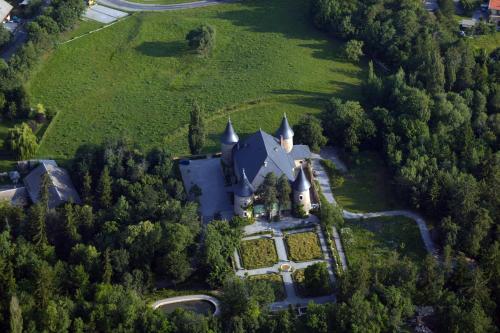 an aerial view of a castle in the forest at Chateau De Picomtal in Crots