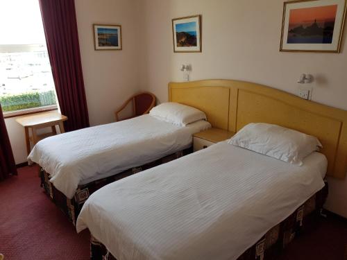 Кровать или кровати в номере Bon Viveur Guest House