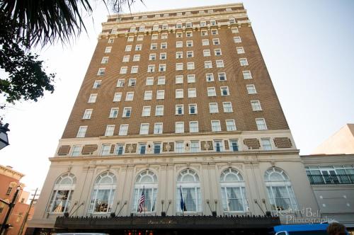 a large building with a clock on the front of it at Francis Marion Hotel in Charleston