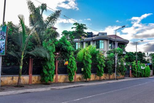 a house on the side of a street at Green Mountain Hotel in Arusha
