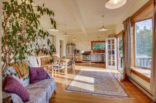 a living room with a couch and a table at Milagra Guest House in Lopez